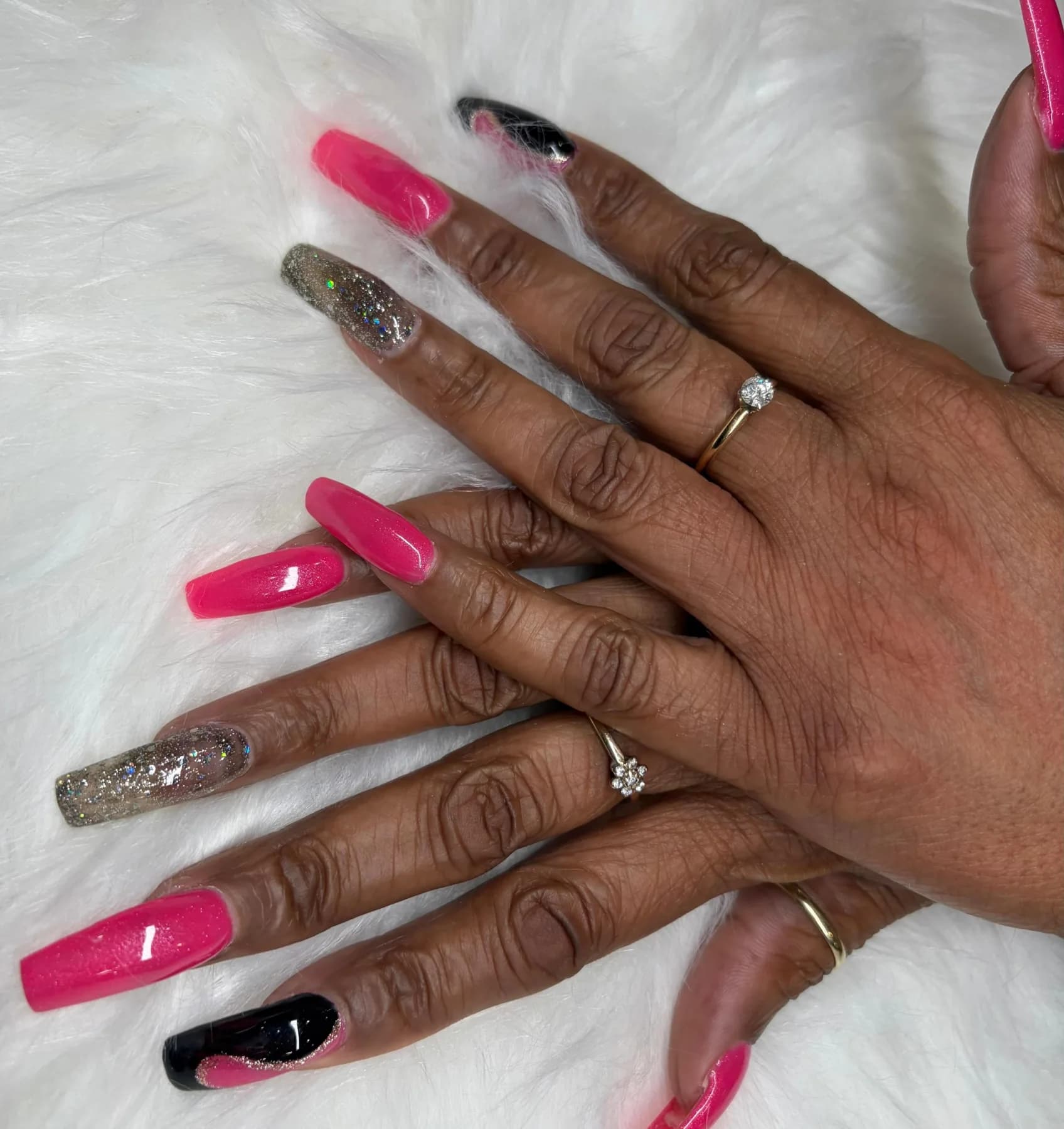 Long pink and black coffin nails with glitter