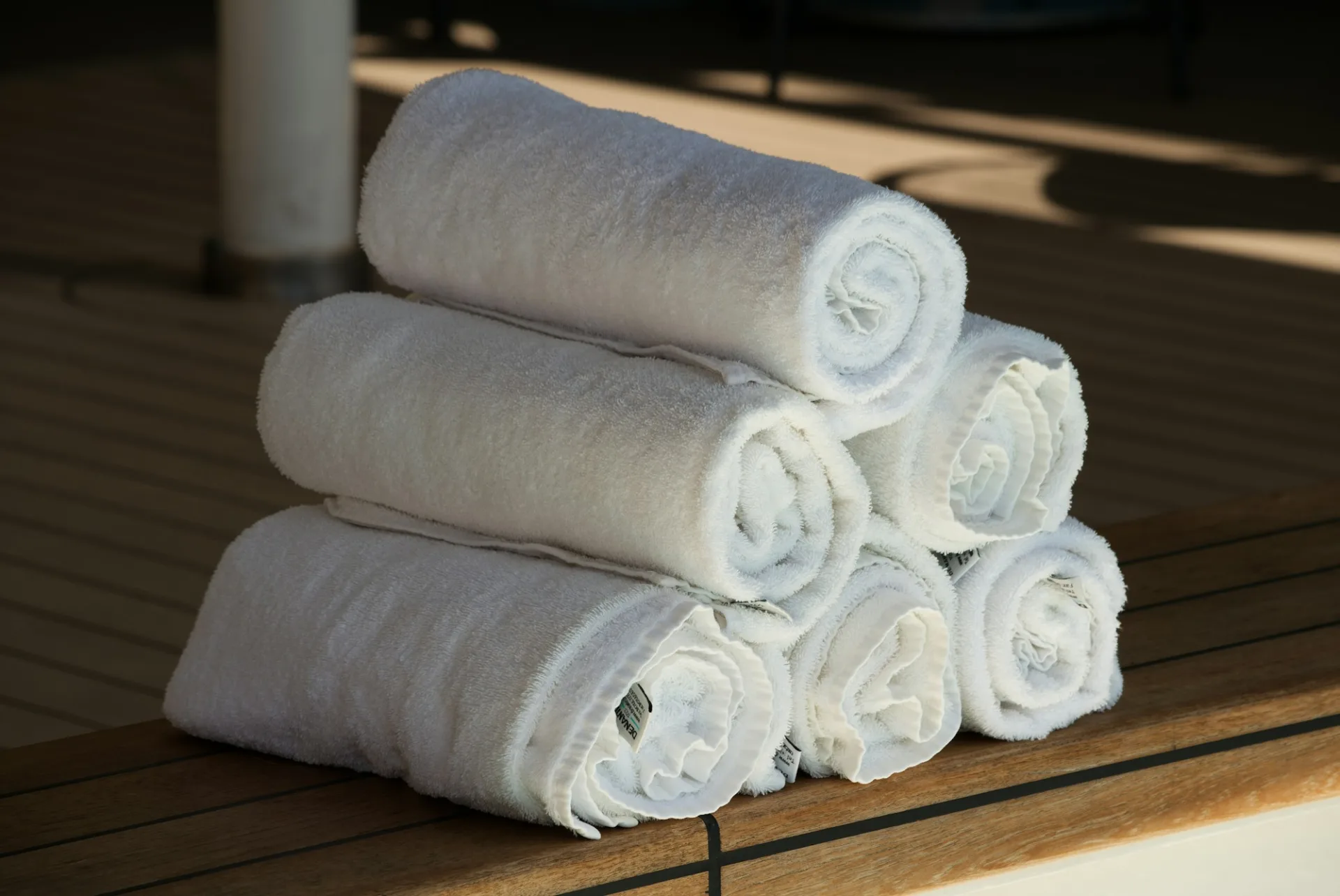 A stack of rolled white towels